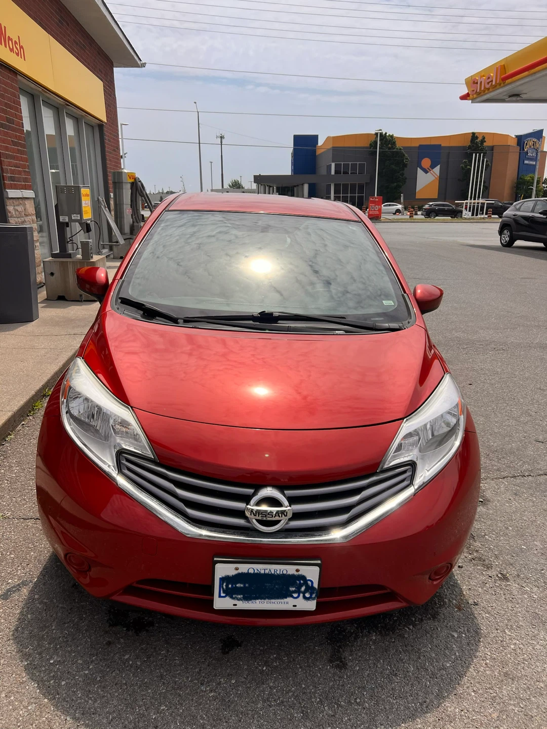 Red Nissan Versa SV