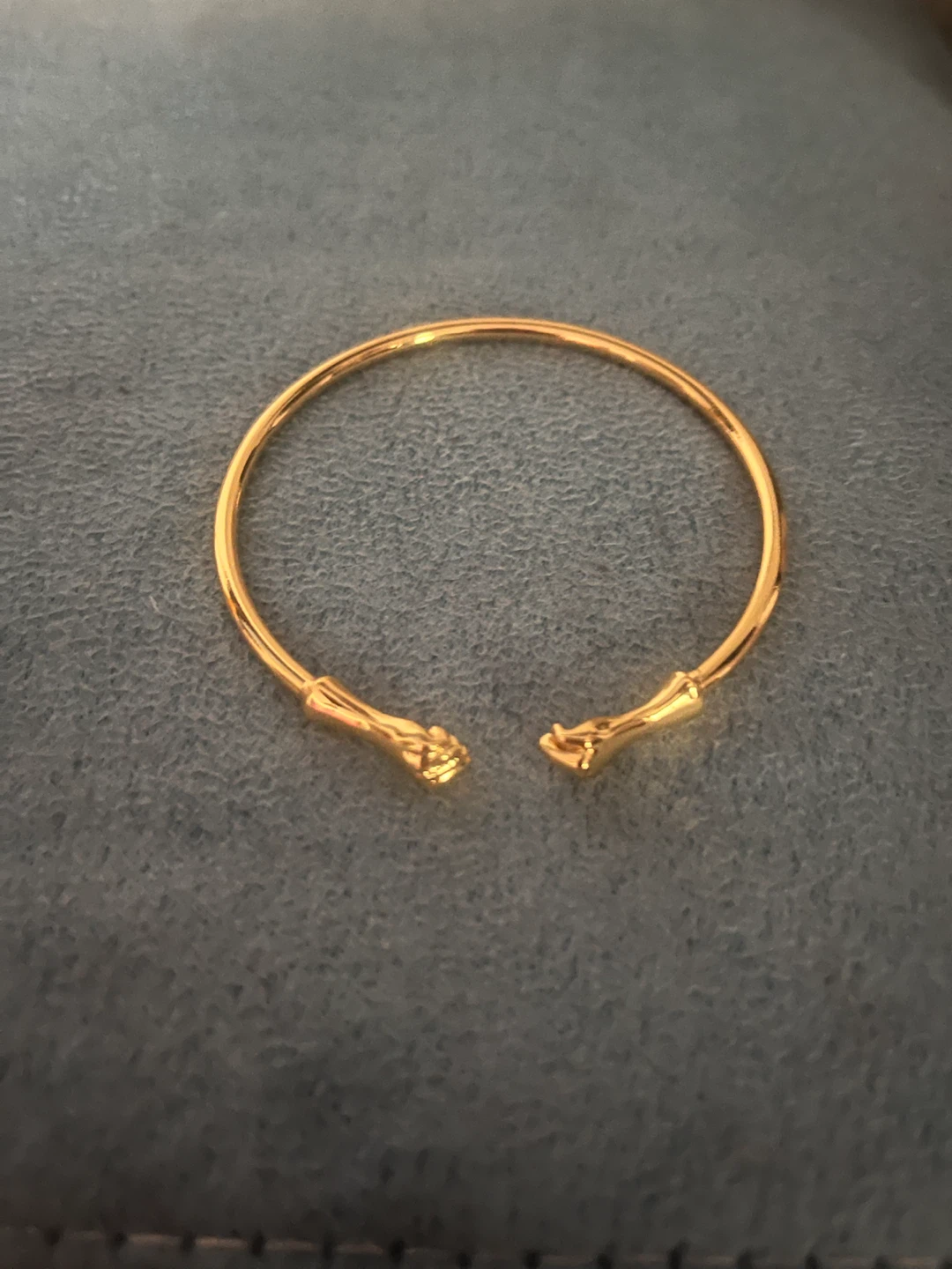 Gold-tone cuff bracelet with hand details - photo 2
