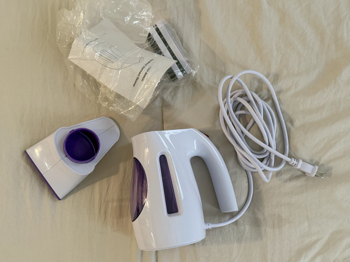 White Handheld Garment Steamer with Purple Accents