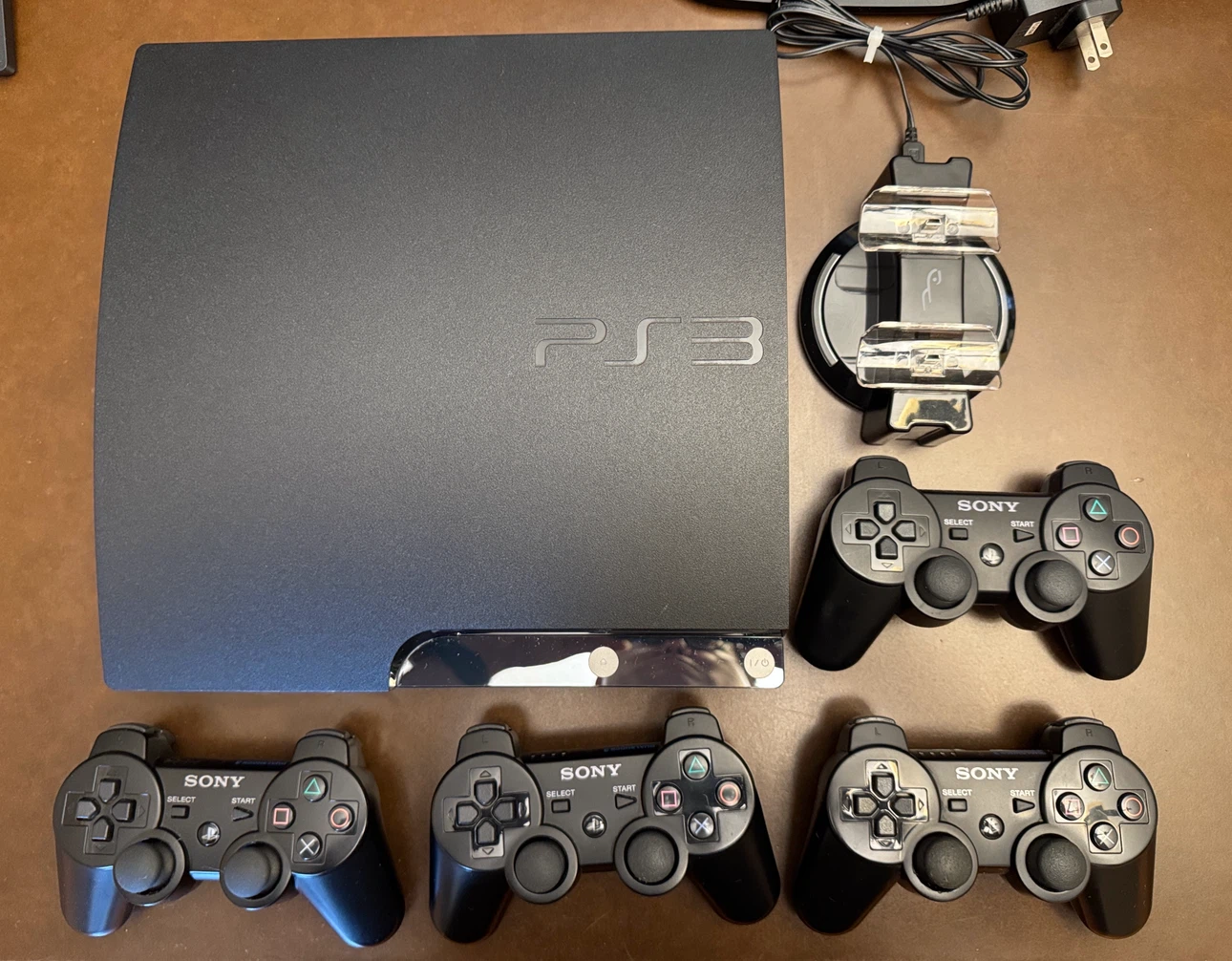 Sony PlayStation 3 Console with 4 Controllers