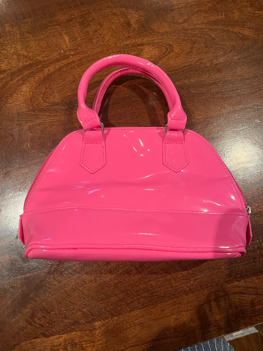 Pink patent handbag