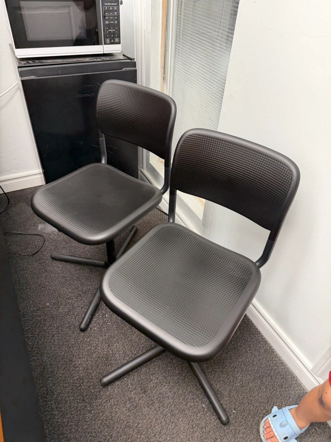 Two black office chairs