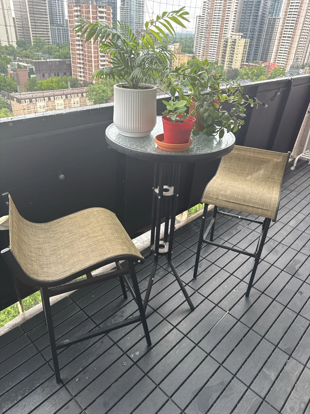 Glass top bistro set with two bar stools