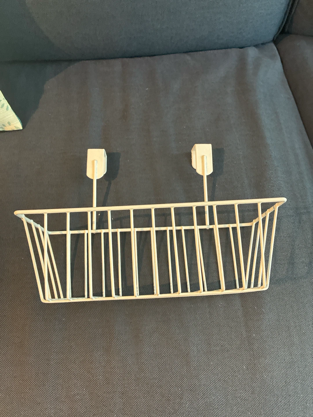 White wire hanging basket — over-shelf / under-shelf storage