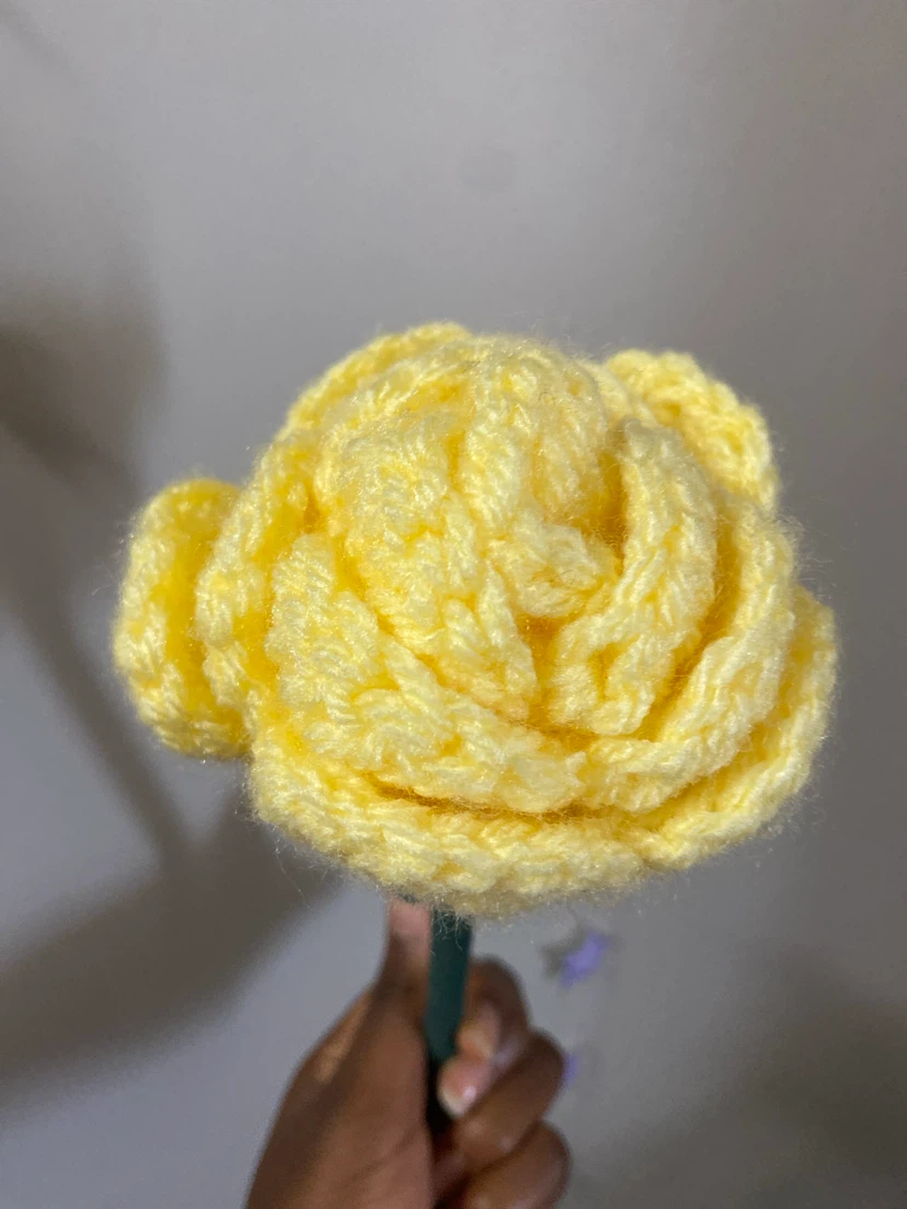 Yellow crocheted rose flower decoration