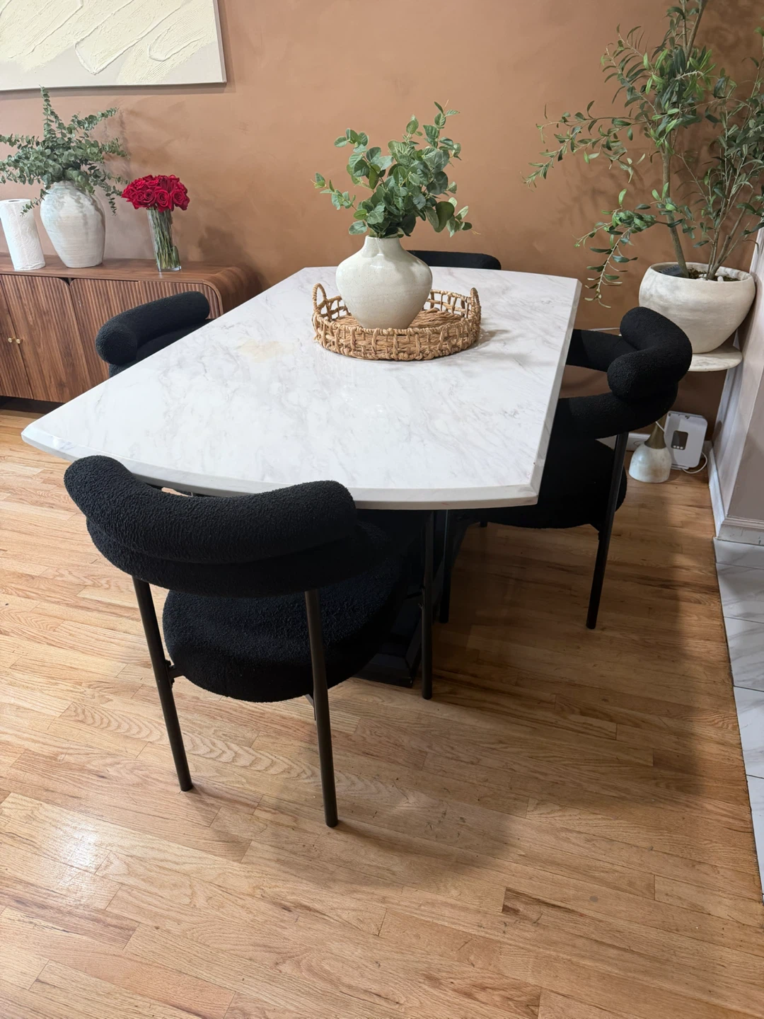 Marble Dining Table with Black Boucle Chairs