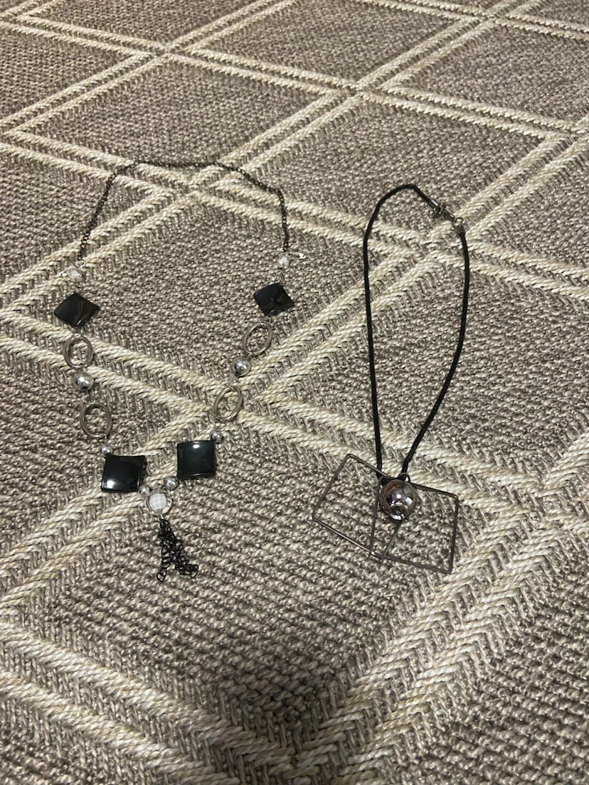 Silver tone necklace set with black square and geometric pendant