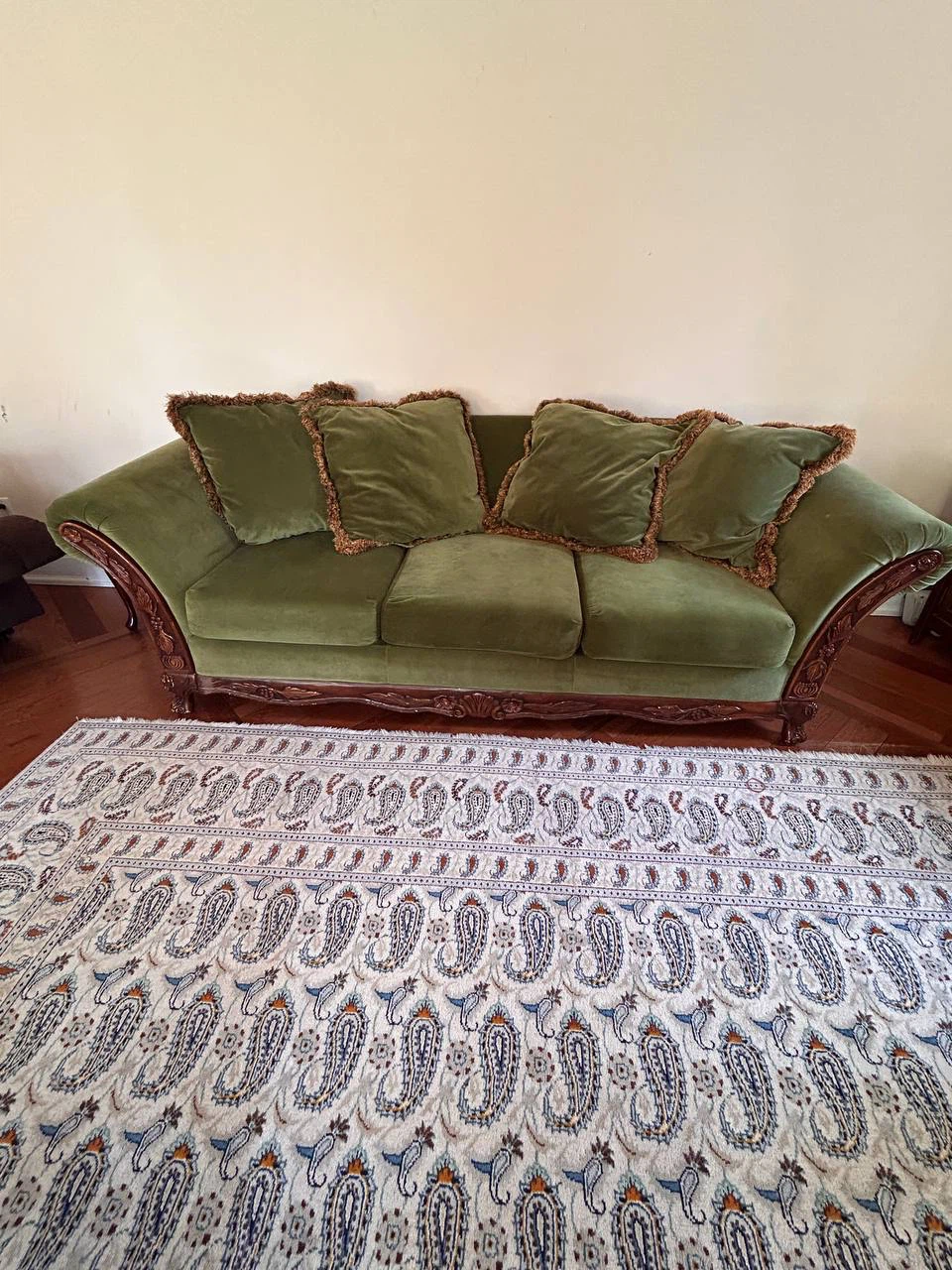 Green Velvet Sofa with Carved Wood Accents