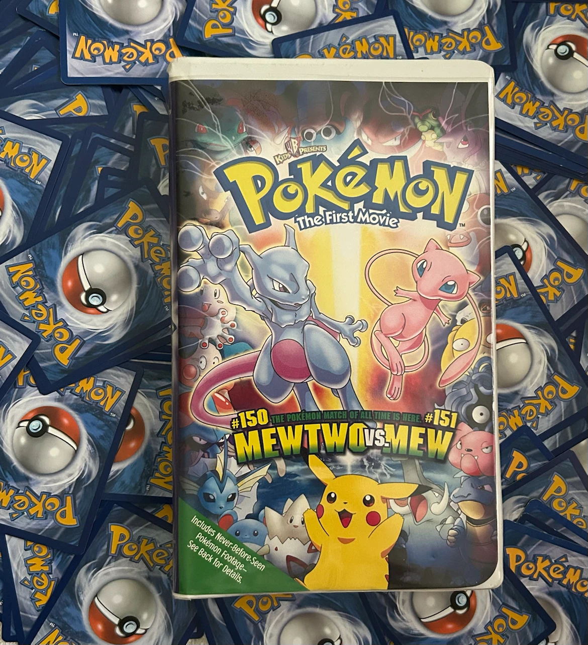 Assorted Pokémon Trading Cards & Pokémon: The First Movie VHS