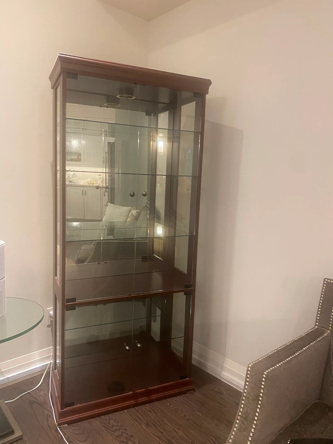 Wooden curio cabinet with glass doors