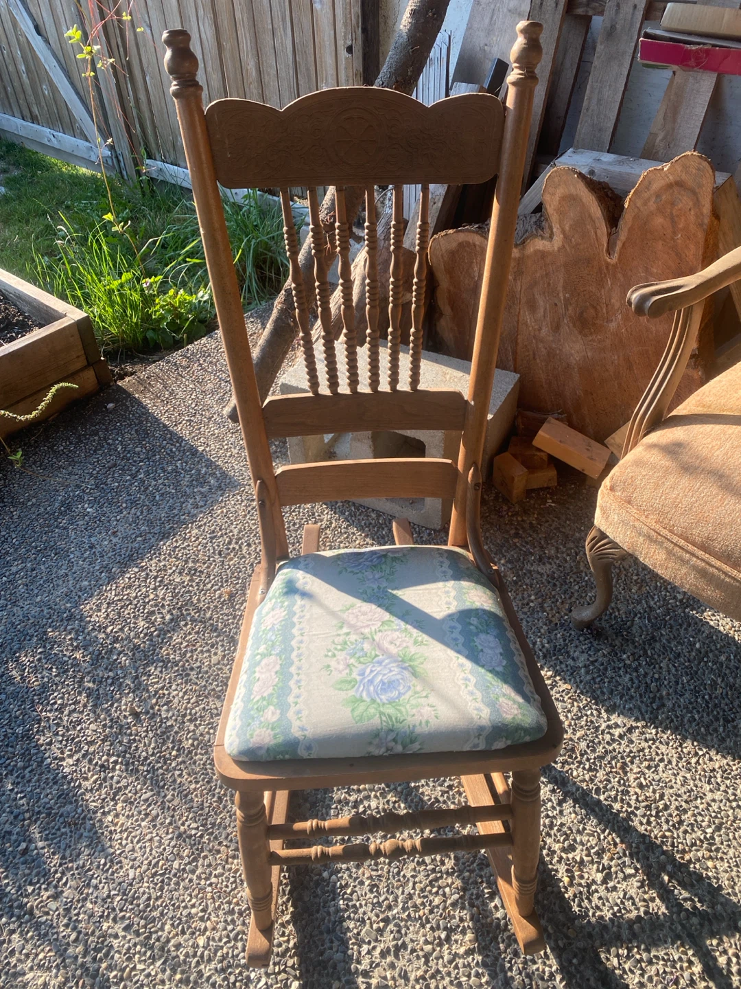 Wooden rocking chair with floral cushion