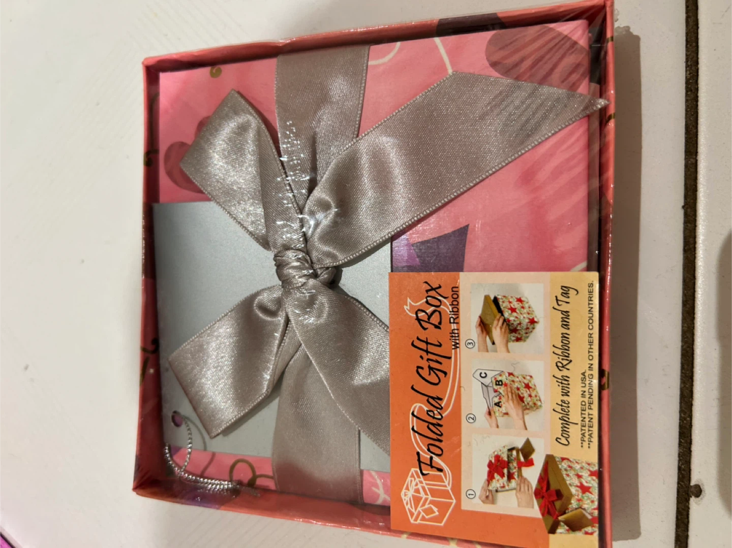 Folded Gift Box with Ribbon and Tag