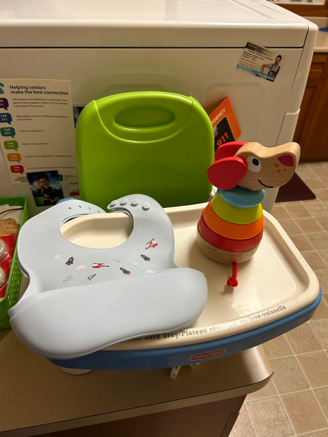 Booster seat  with 2 bibs and Hape toy