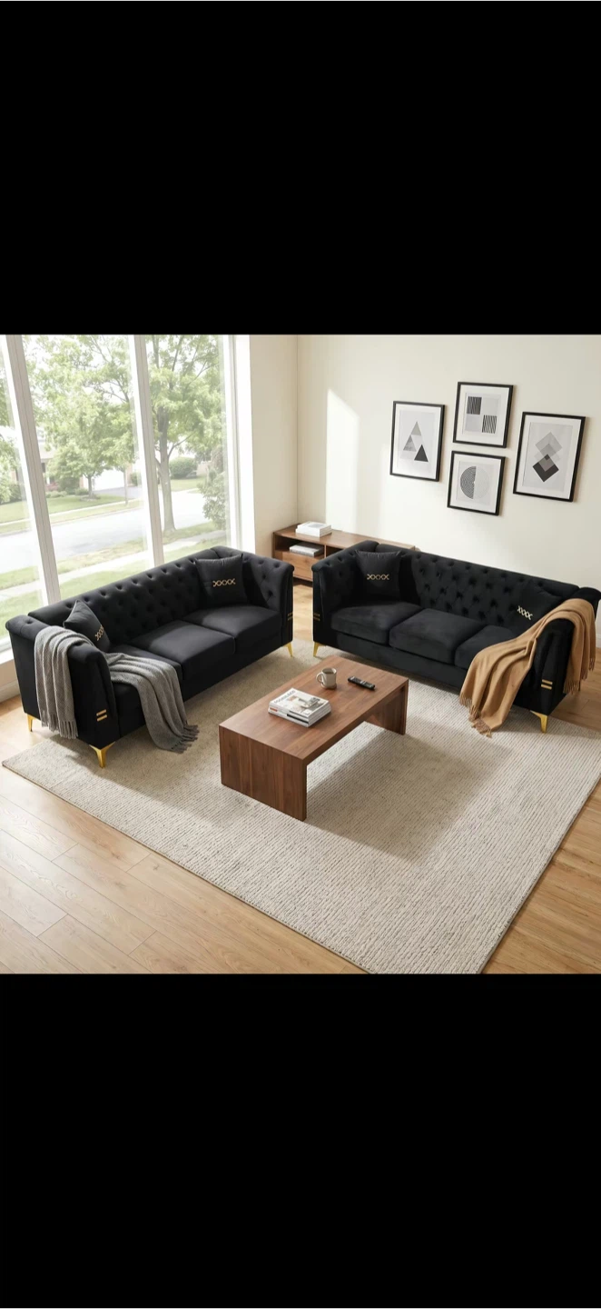 Black Tufted Sofa with Gold Accents