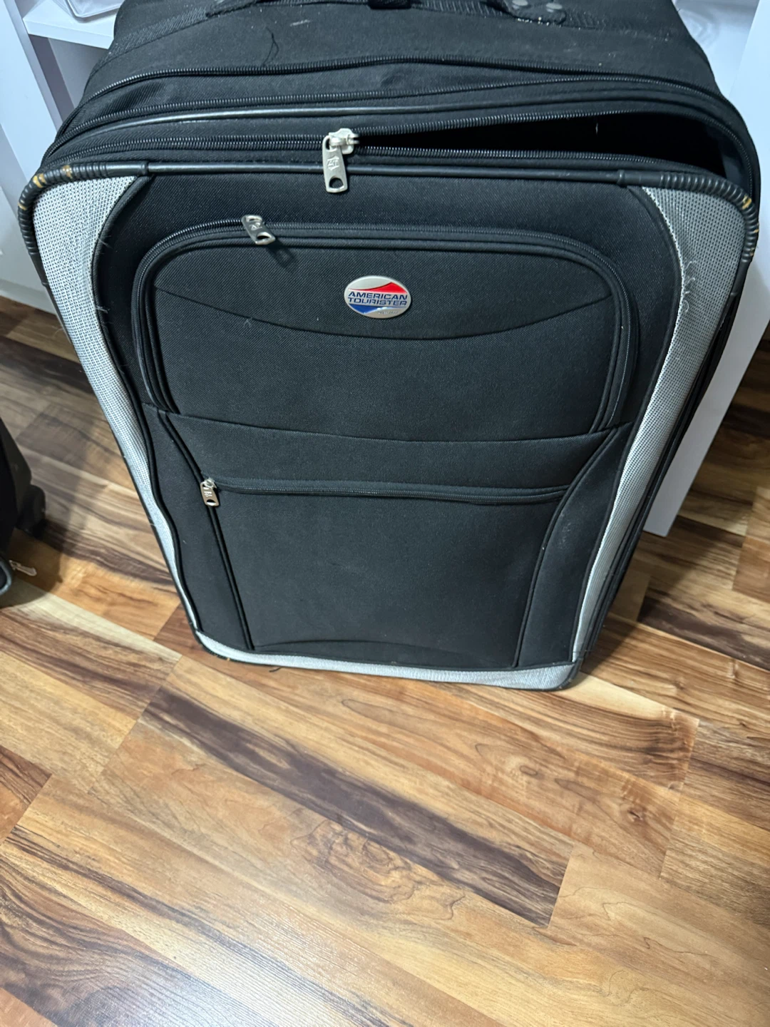 American Tourister Rolling Suitcase