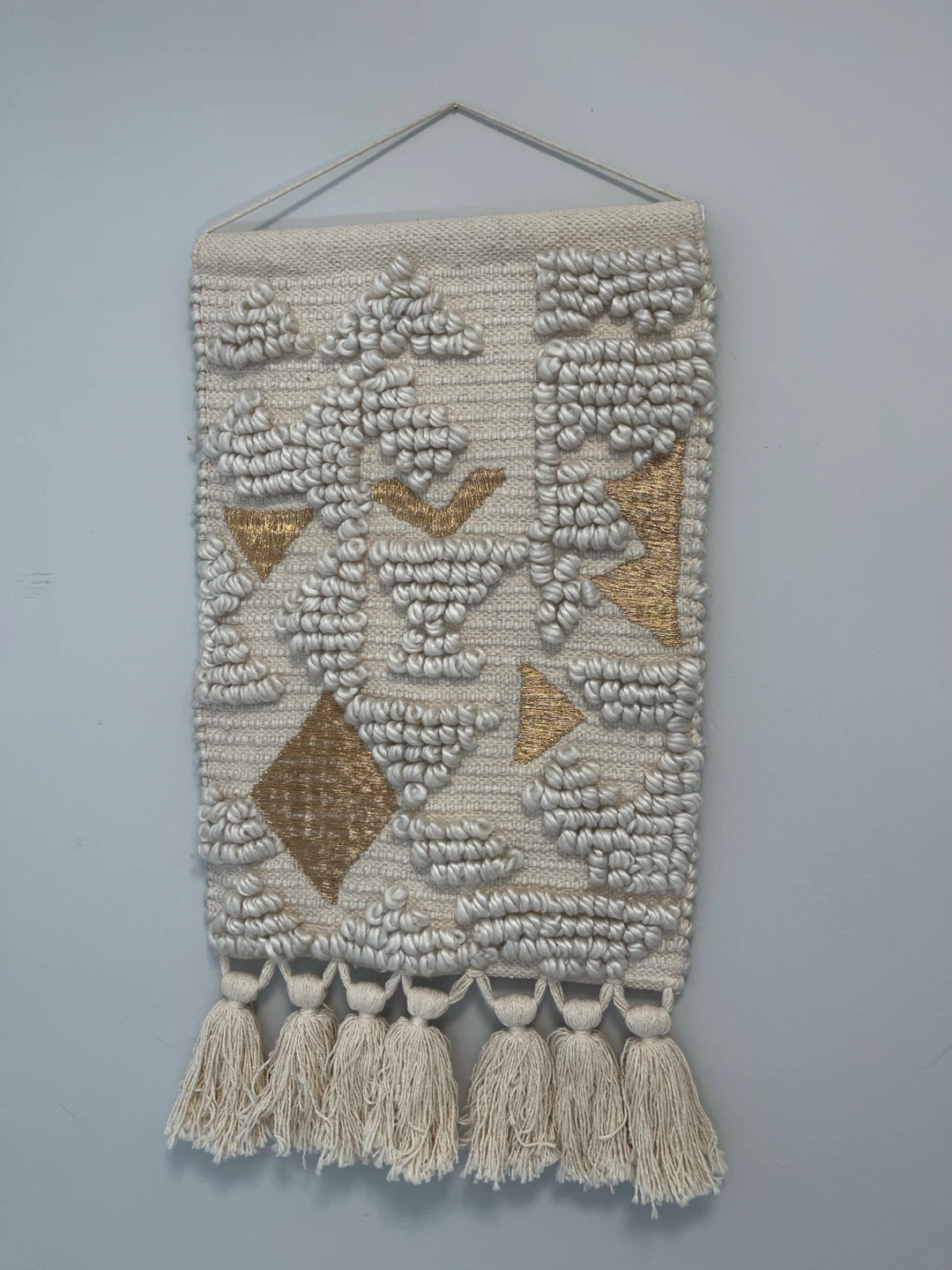 Textured Wall Hanging with Tassels and Gold Accents