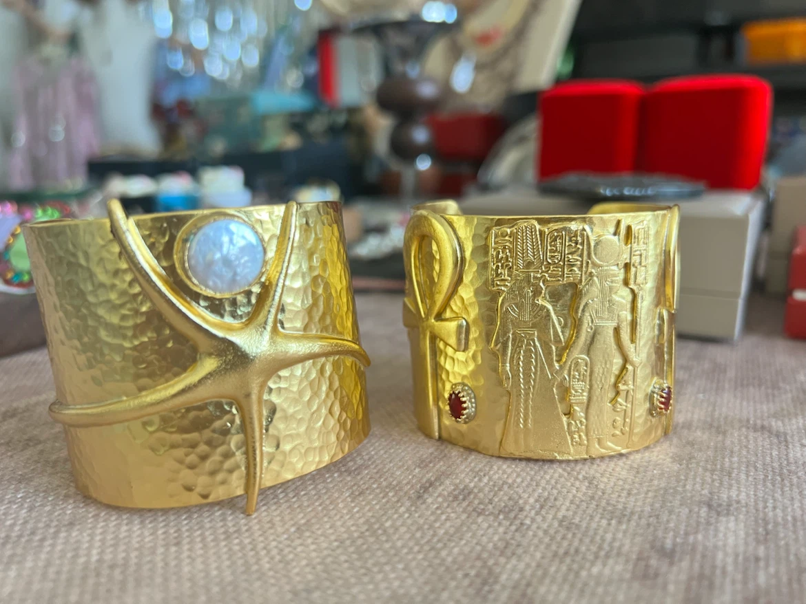 Gold Tone Cuff Bracelet with Starfish and Pearl Accent