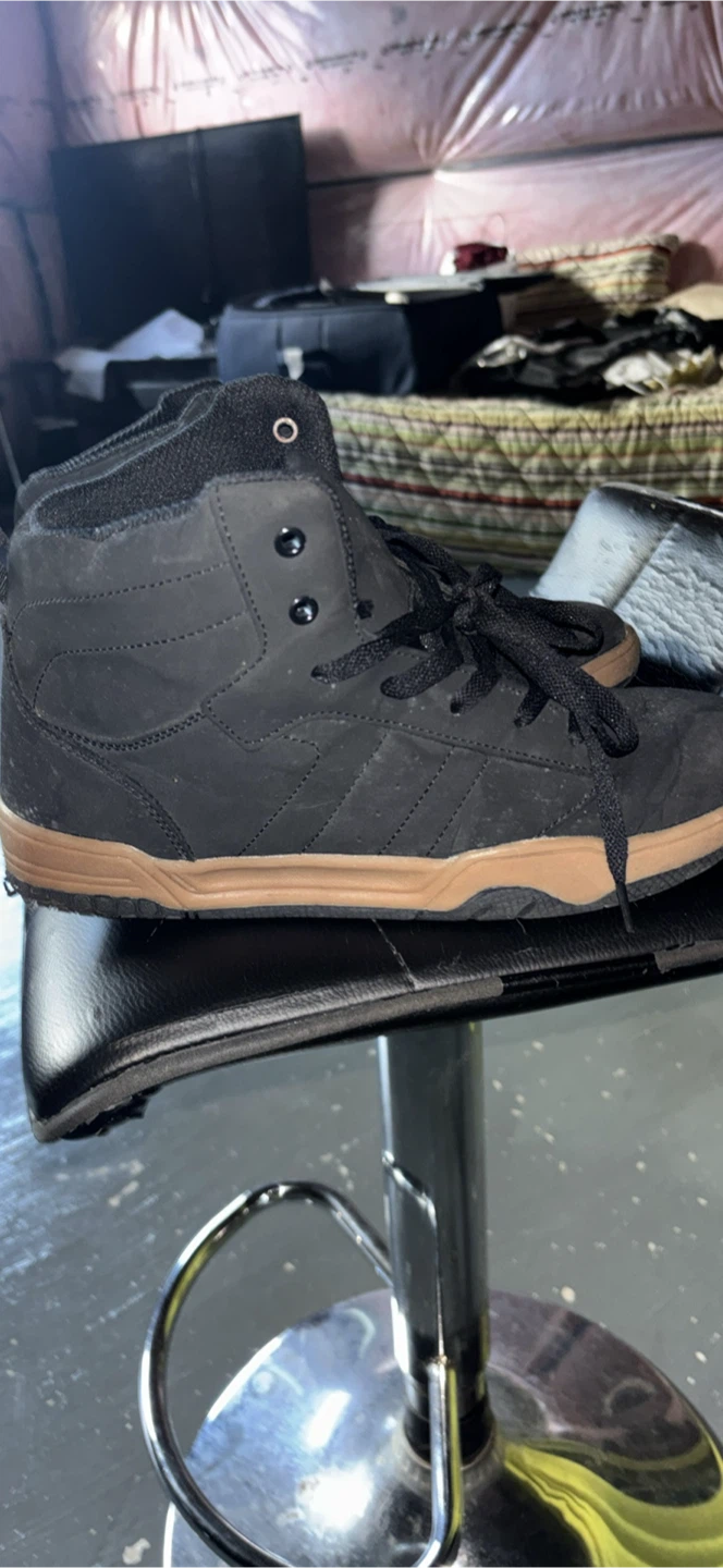 Black high-top skate shoes