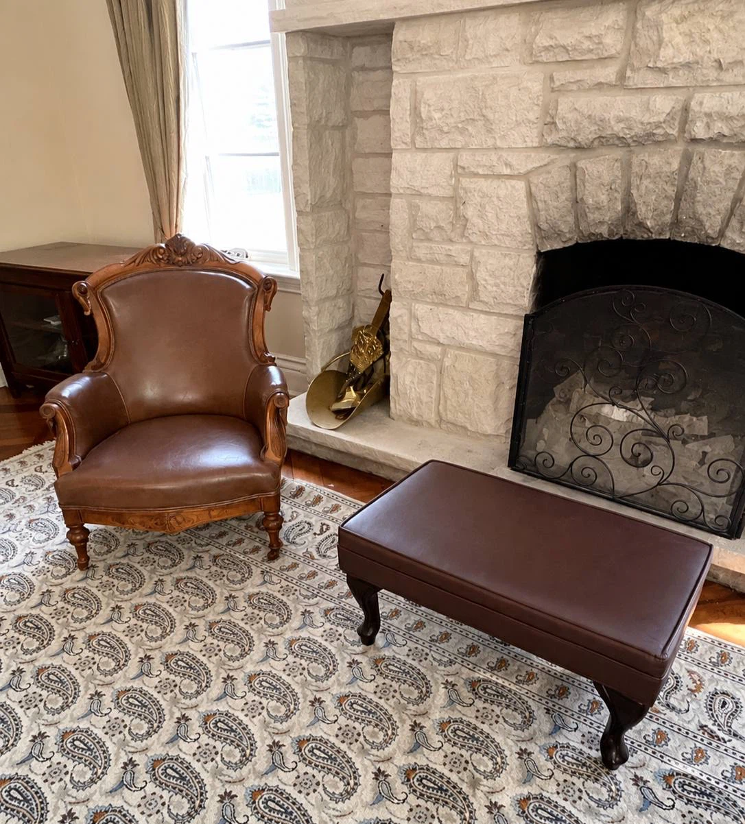 Brown Leather Armchair and Ottoman