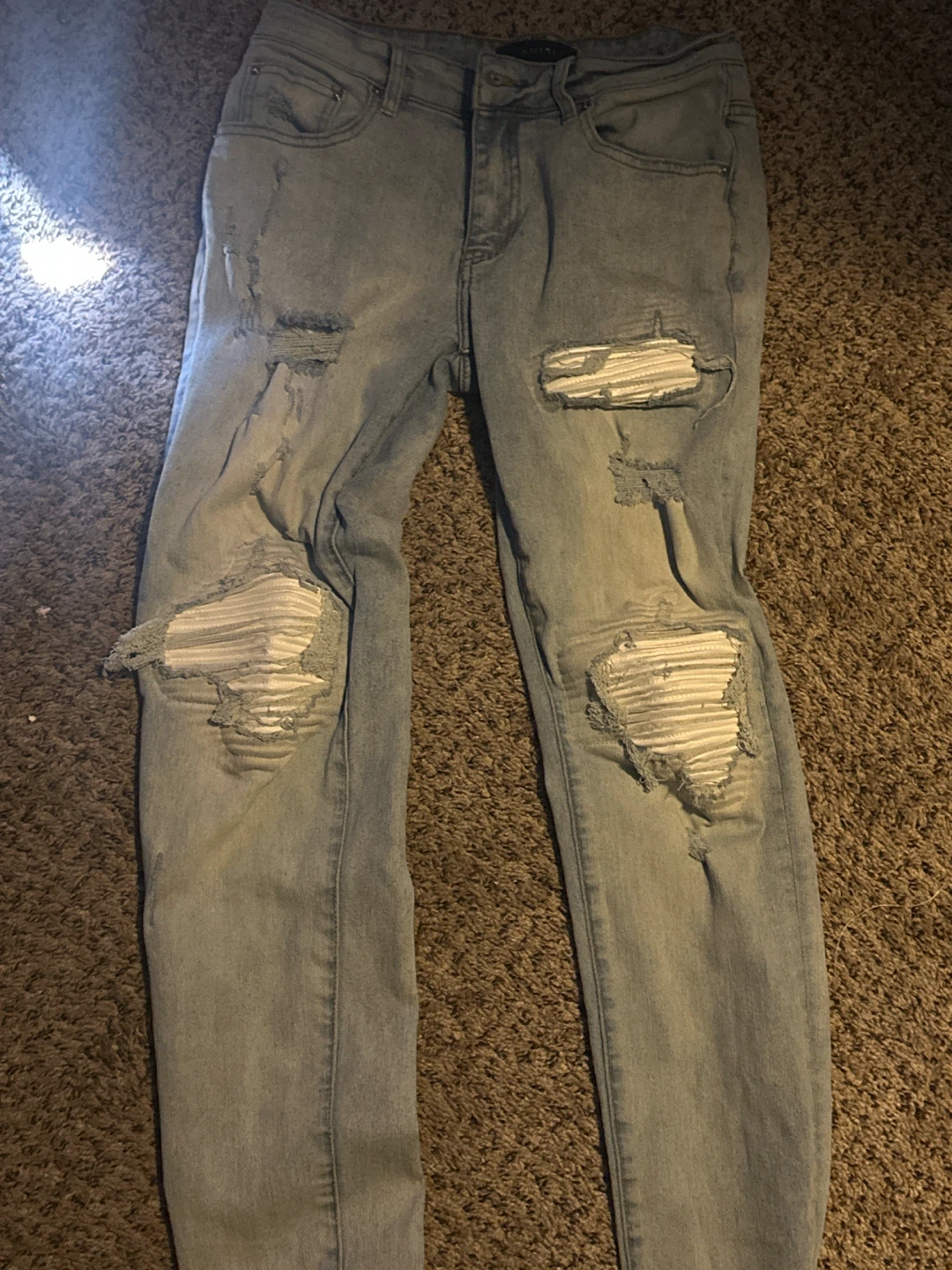 AMIRI distressed light wash jeans