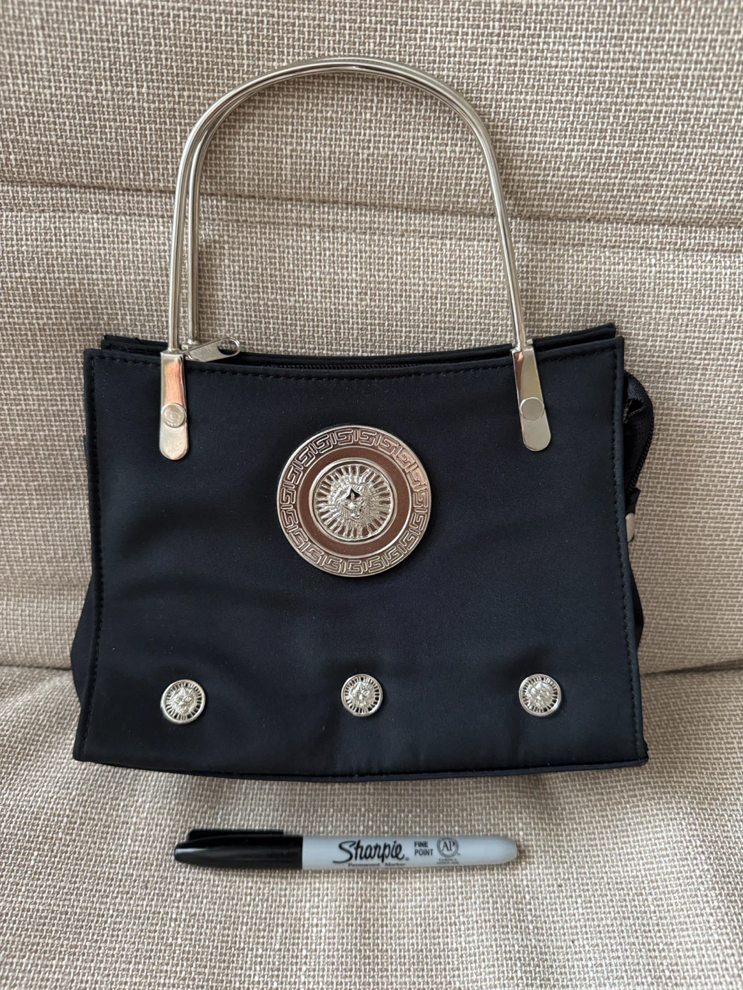 Black Handbag with Decorative Medallion