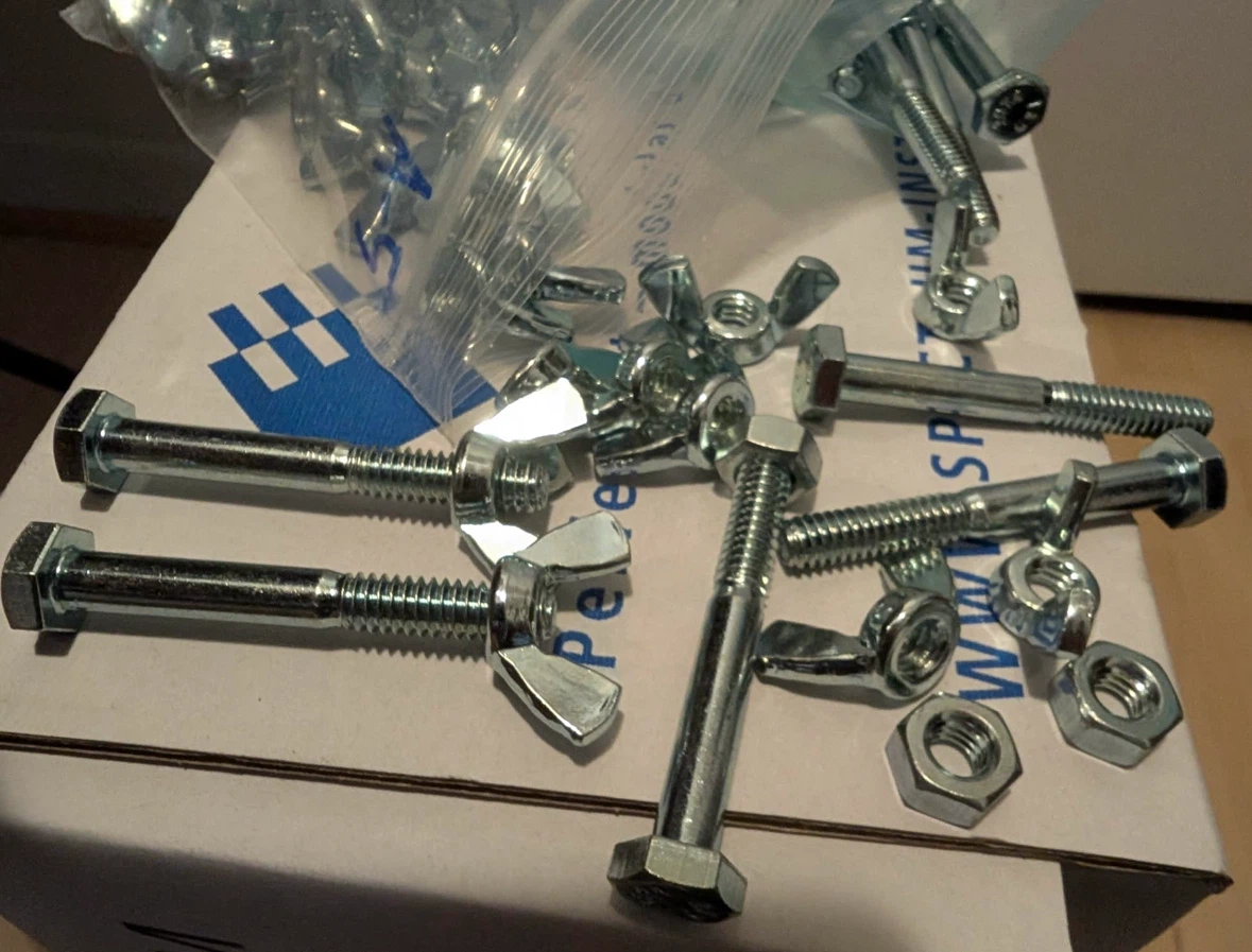Assorted Hex Bolts, Wing Nuts, & Hex Nuts selling as lot