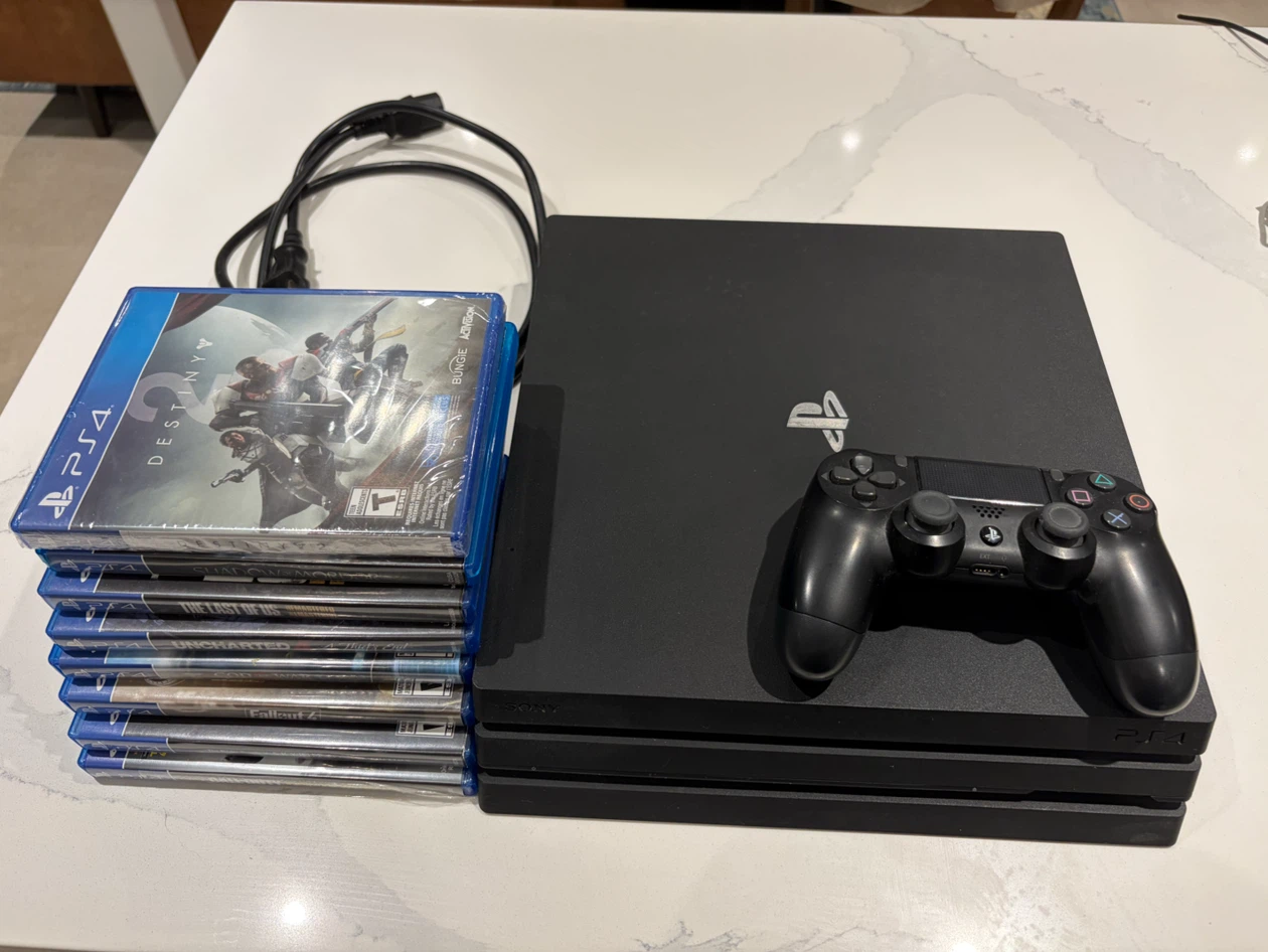 Sony PlayStation 4 Pro with Games and Controller