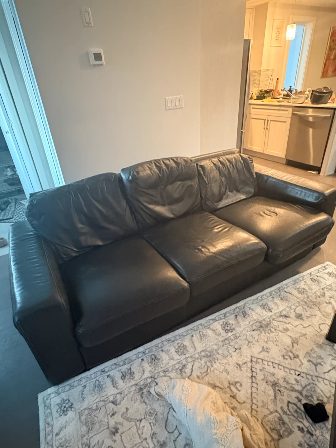 Black leather couch with love seat