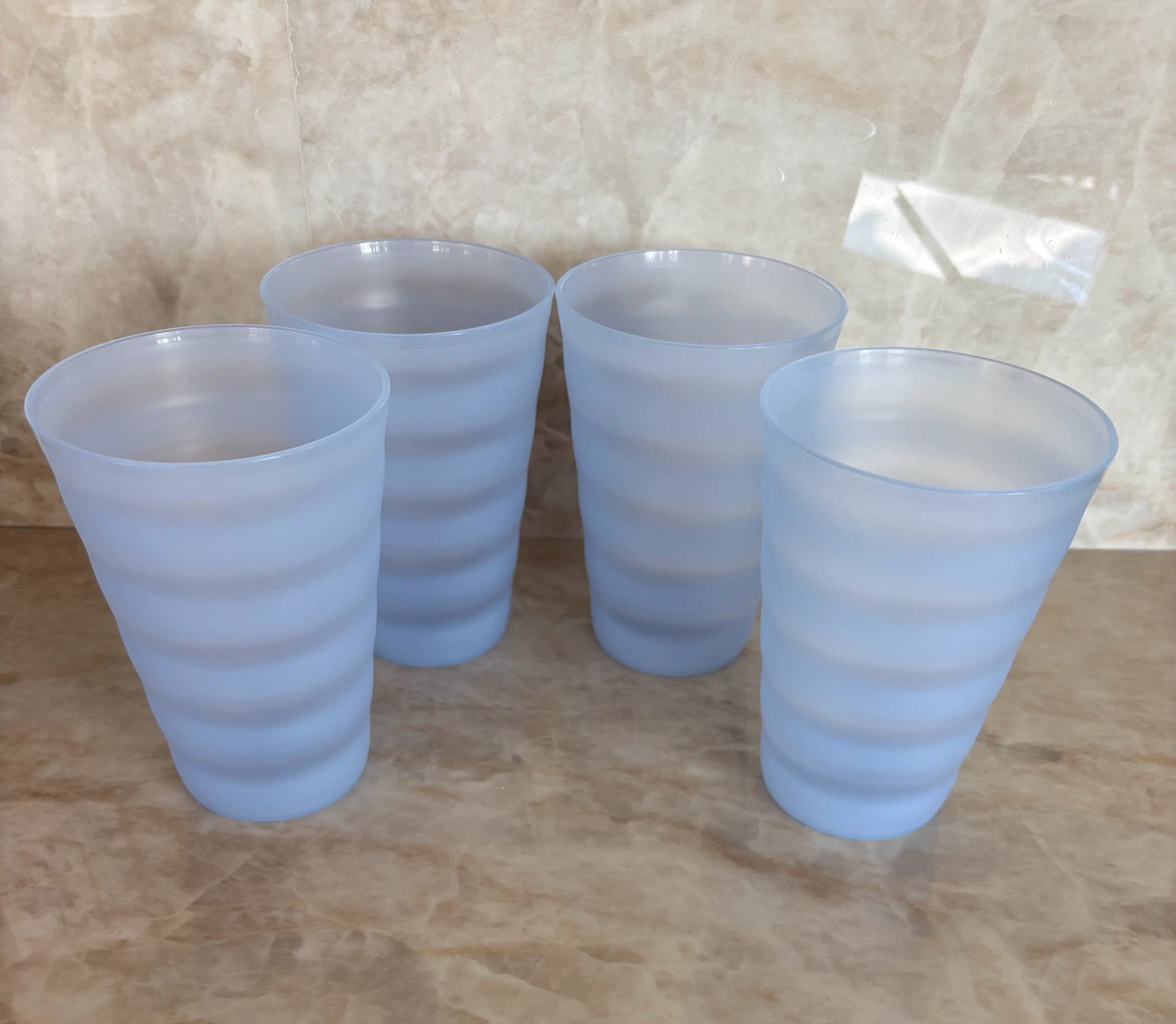 Many sets of Tupperware Tumblers