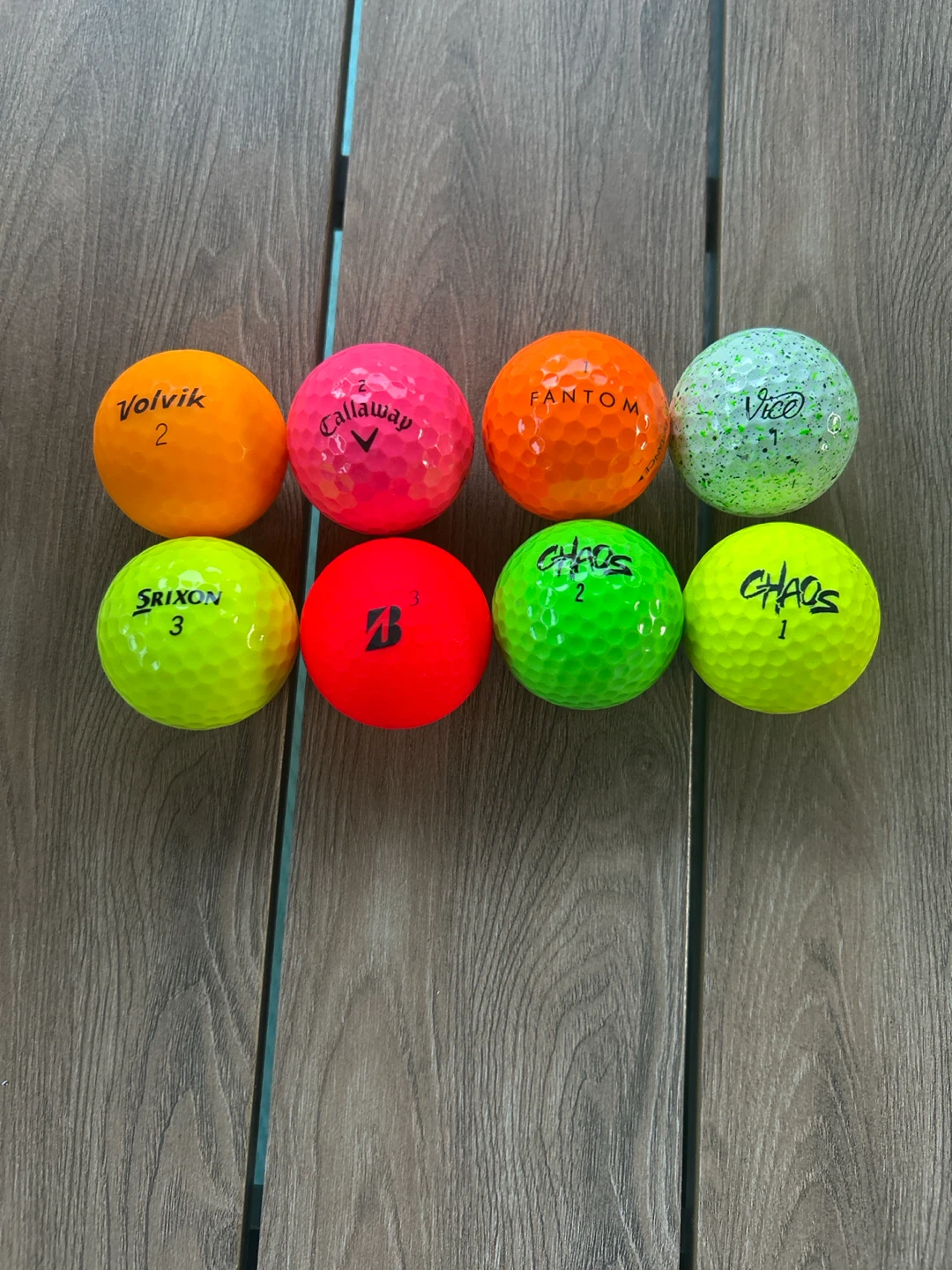 Multiple brands of colured golf balls
