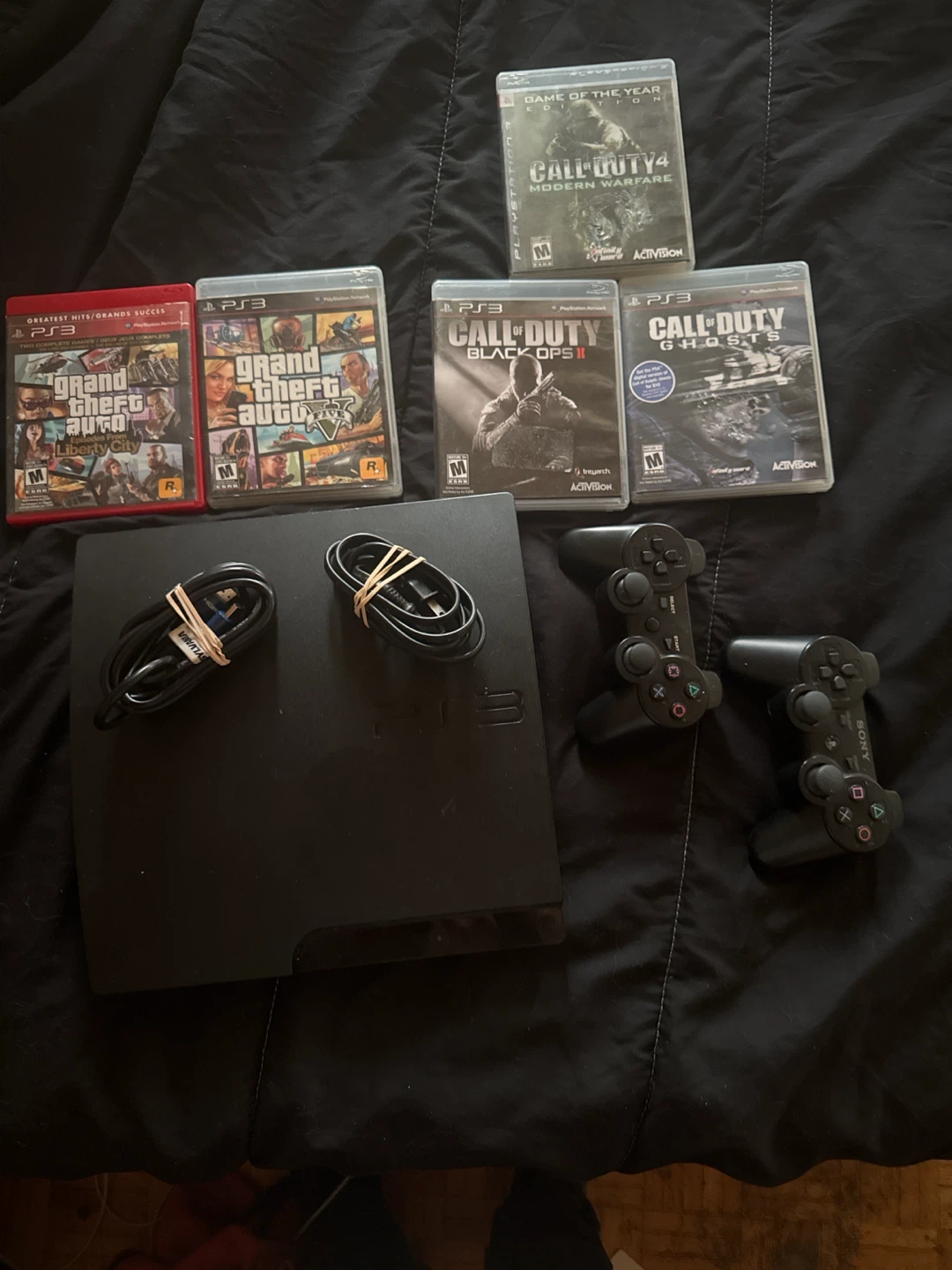 PlayStation 3 Console with Games and Controllers