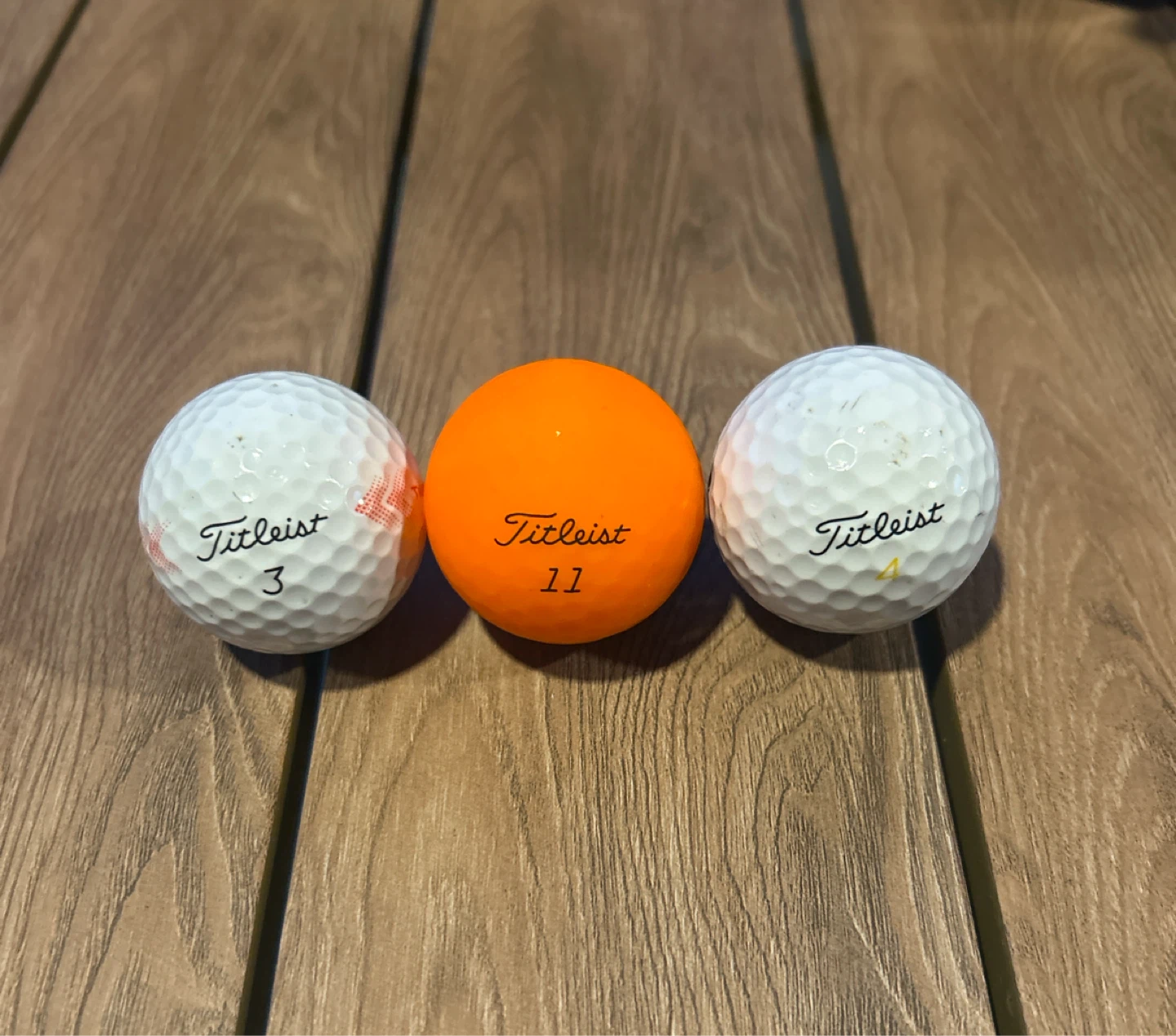 Titleist Golf Balls - White (3 & 4) and Orange (11)