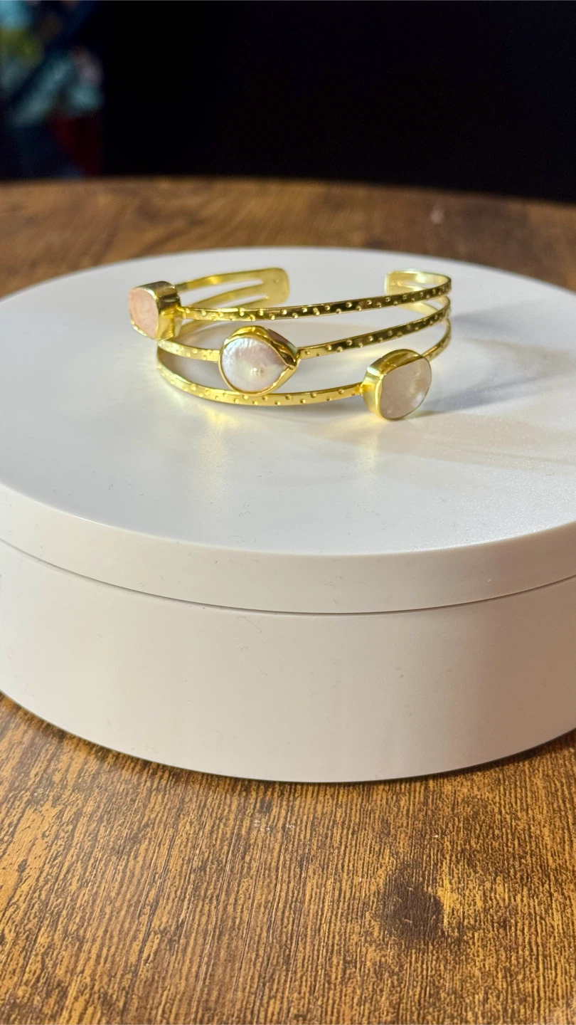 Gold-tone cuff bracelet with stones
