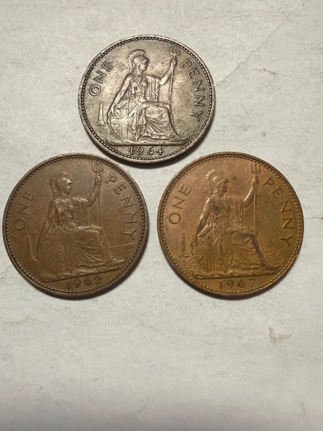 Three UK Penny Coins (1962, 1964, 1967)