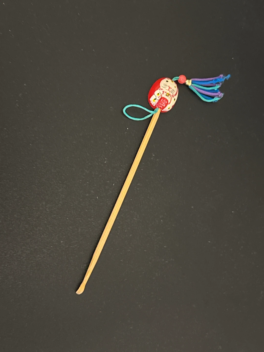 Daruma doll skewer with tassel