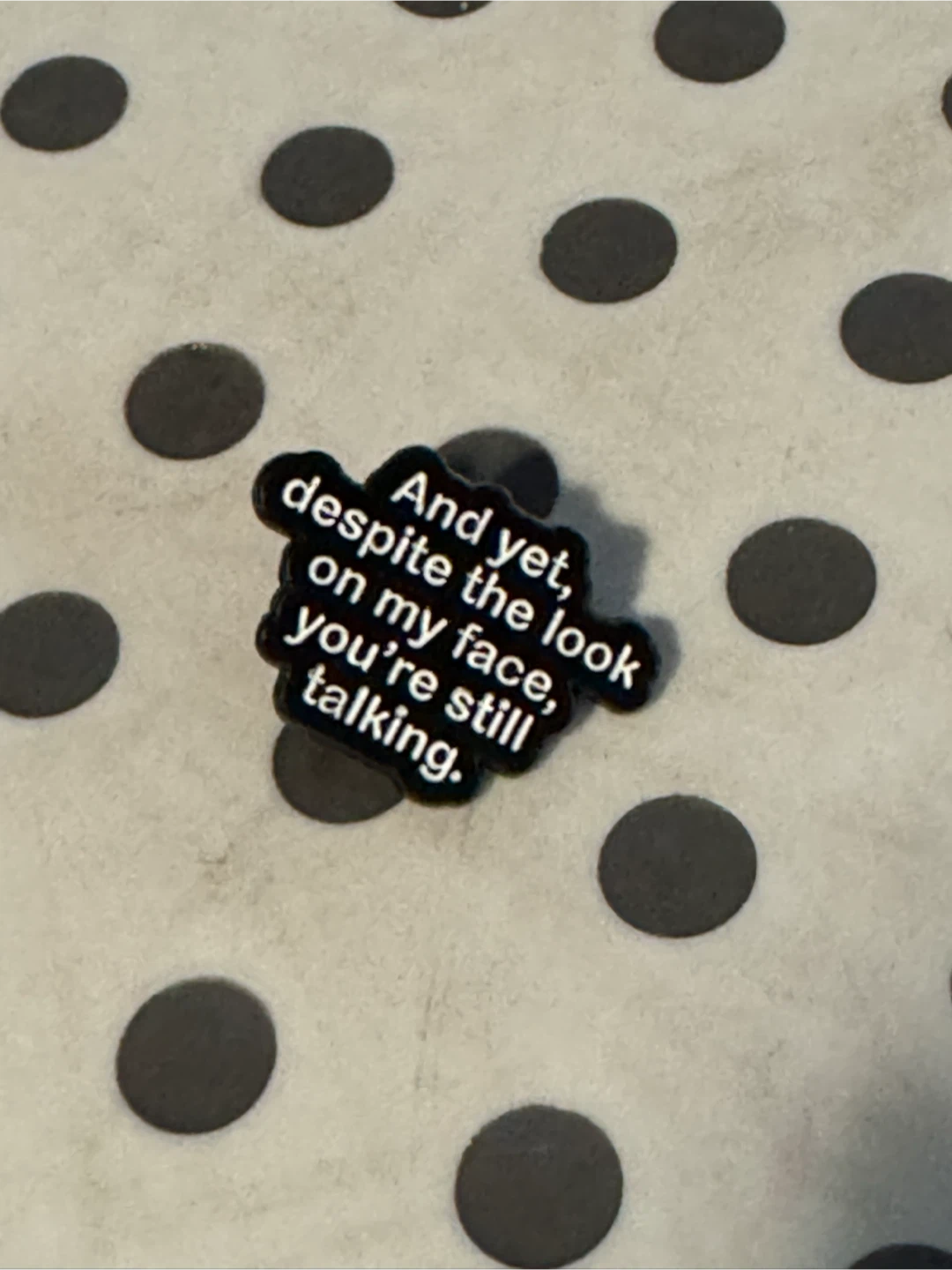 Enamel Pin - "despite the look on my face, still talking."