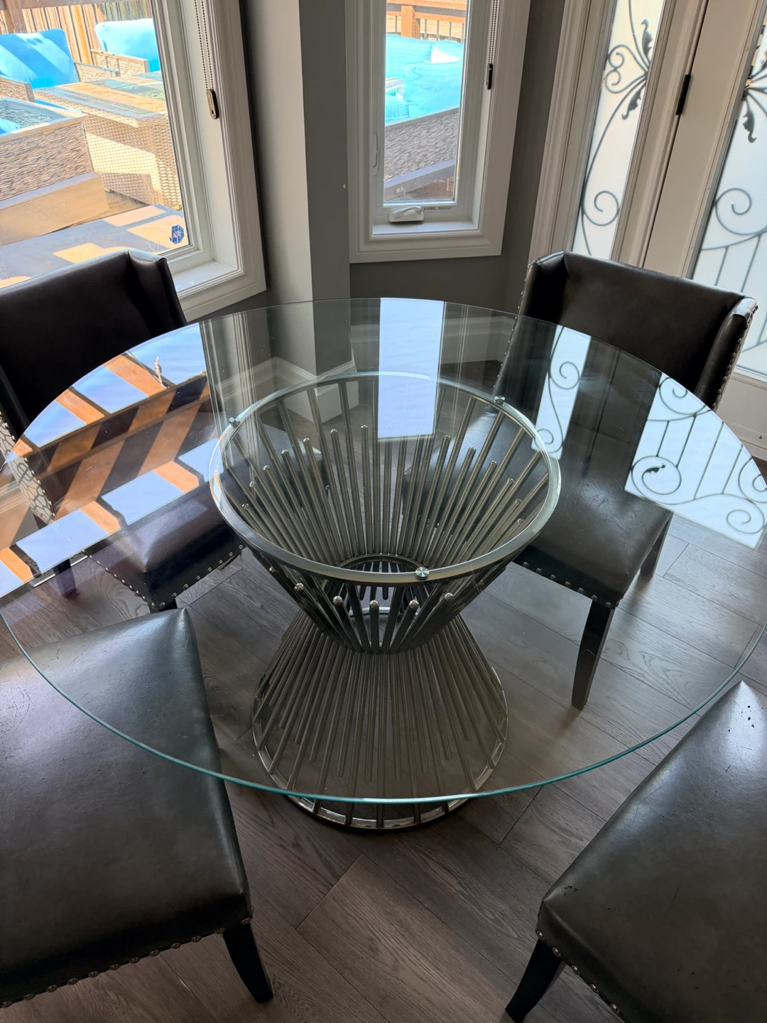 Glass Top Dining Table with silver Spoke Metal Base