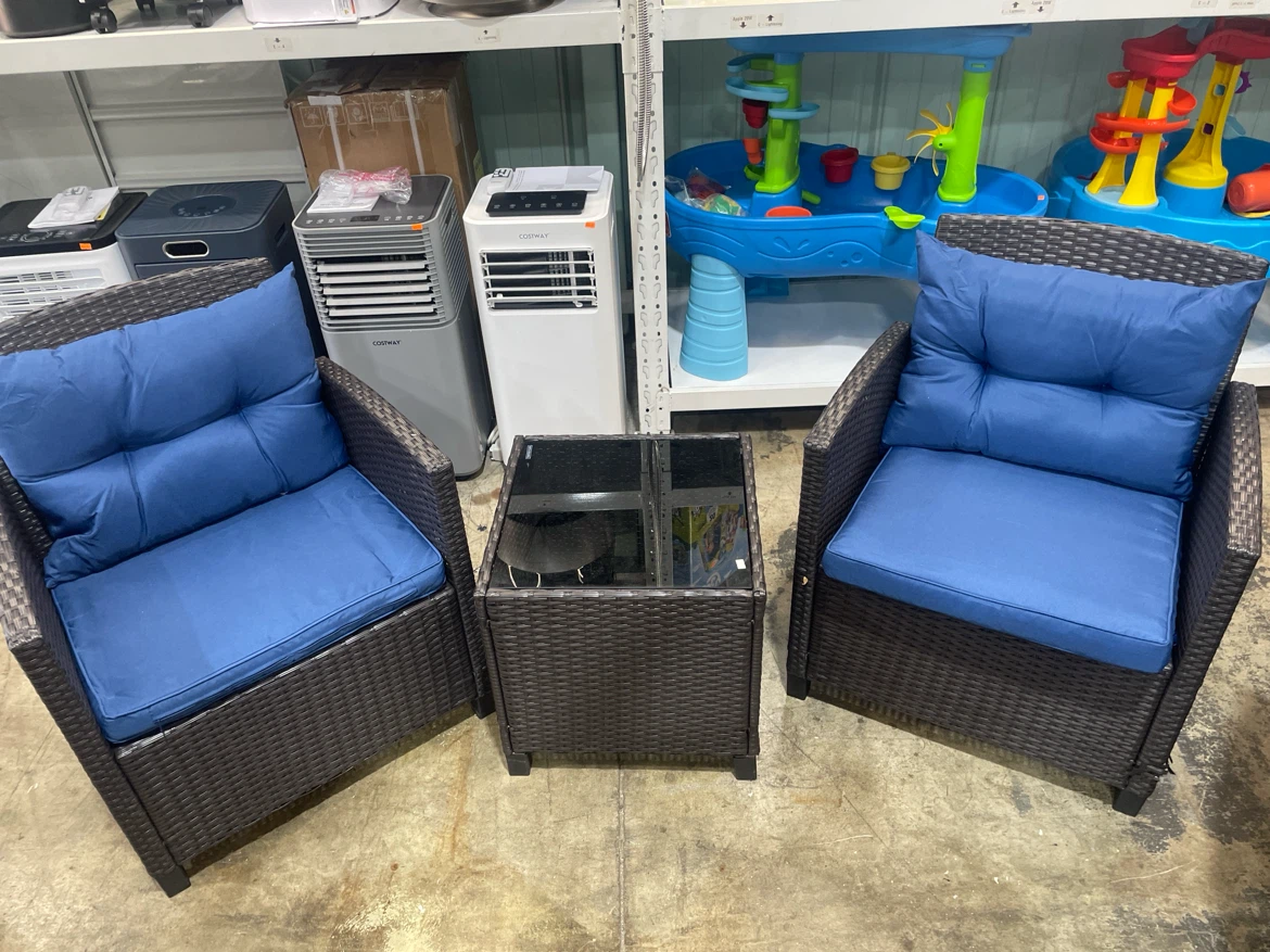Wicker patio chair with blue cushion