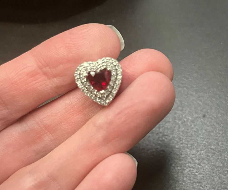 Heart-shaped pendant with red stone and crystals