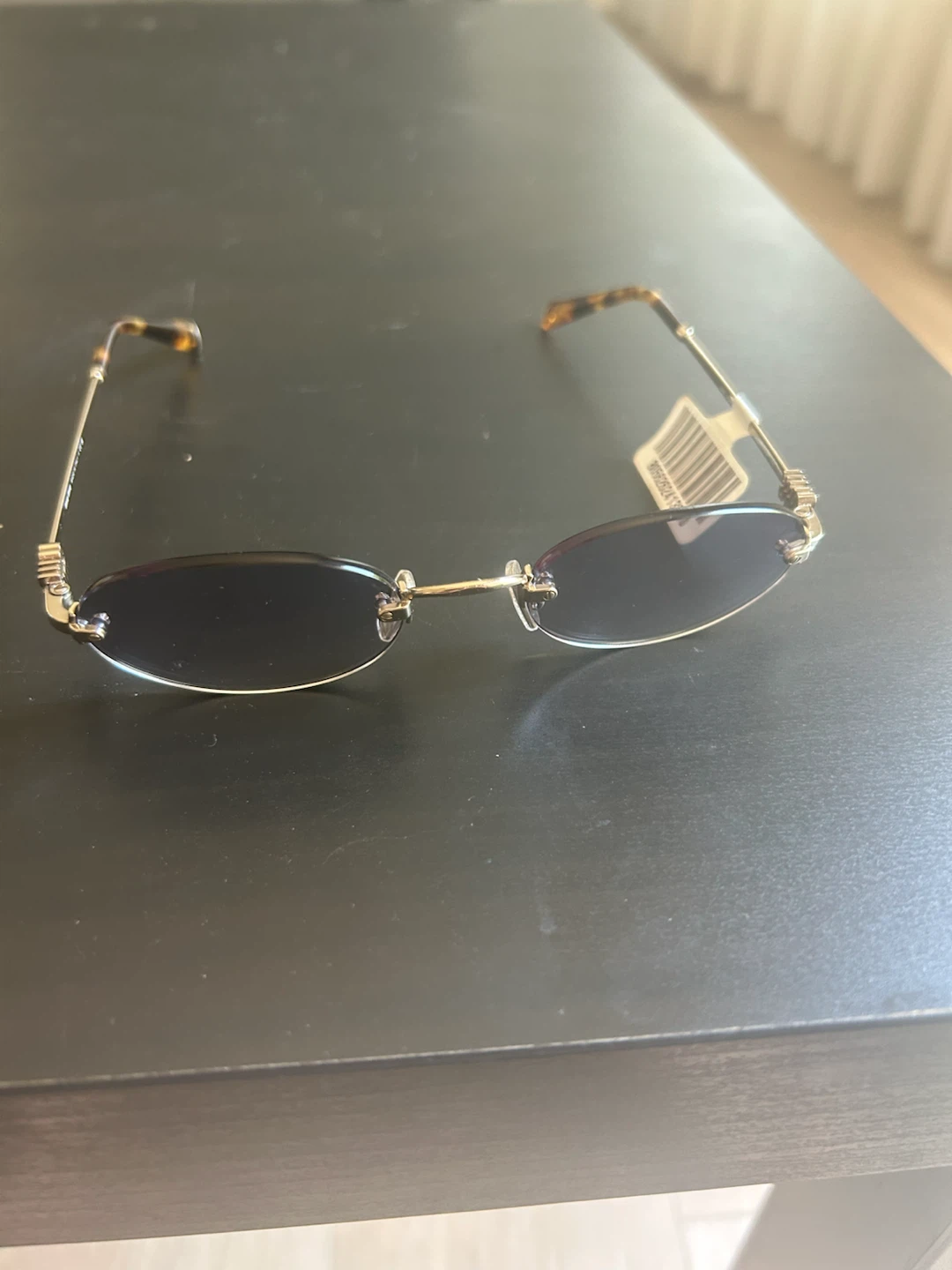 Miu Miu MU A54S Oval Rimless Sunglasses