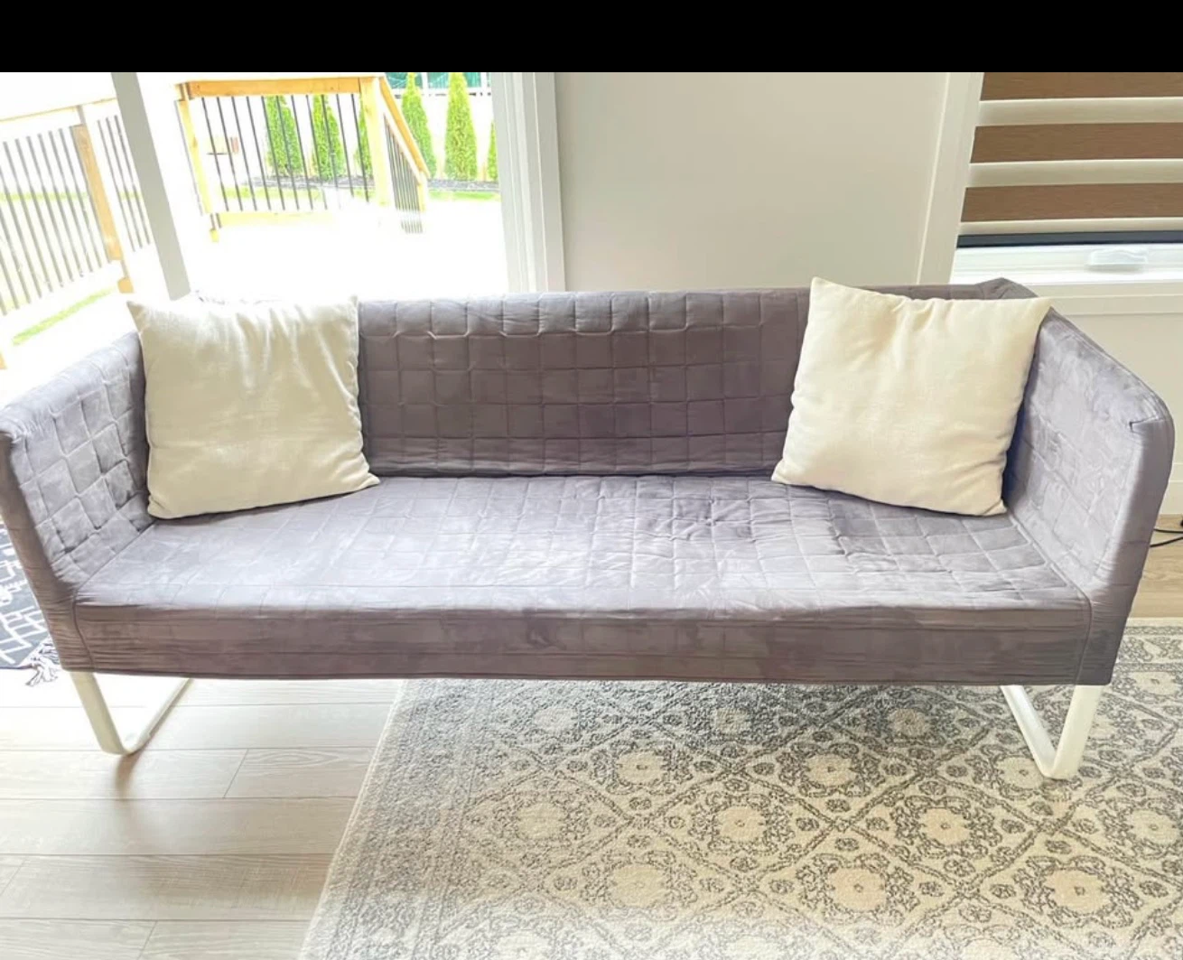 Grey Tufted Loveseat with 2 Cream Pillows