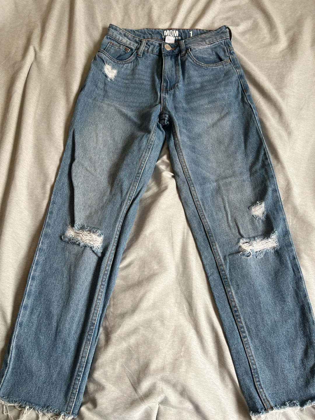 High RiseLight Wash Distressed Denim