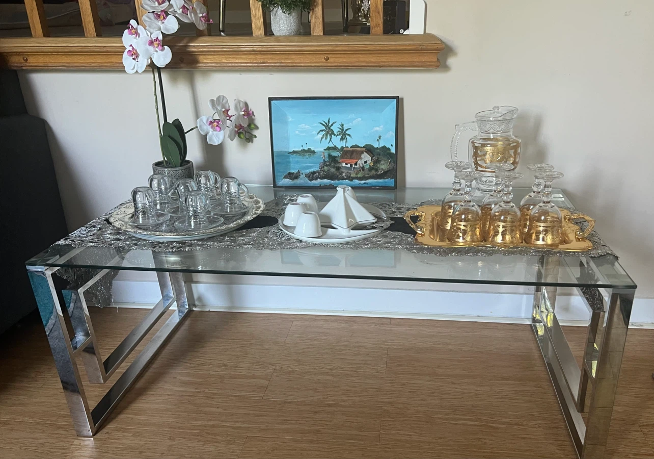 living room table , and juice , coffee glasses