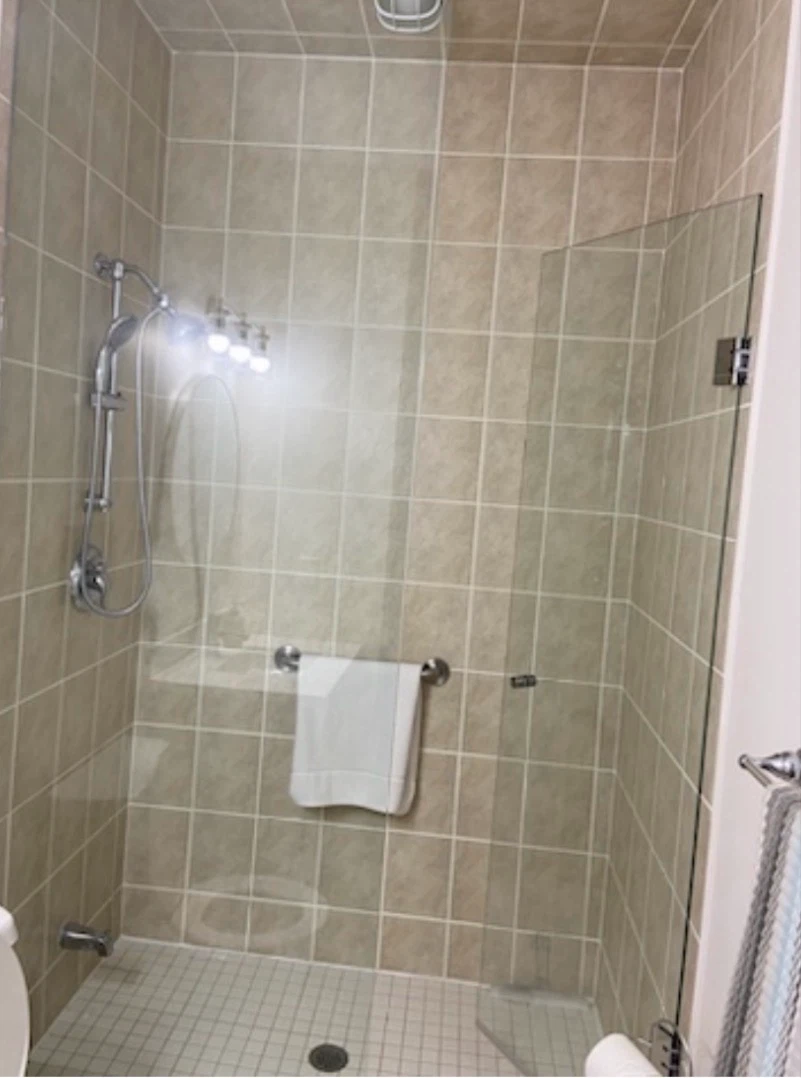 Shower enclosure with glass door