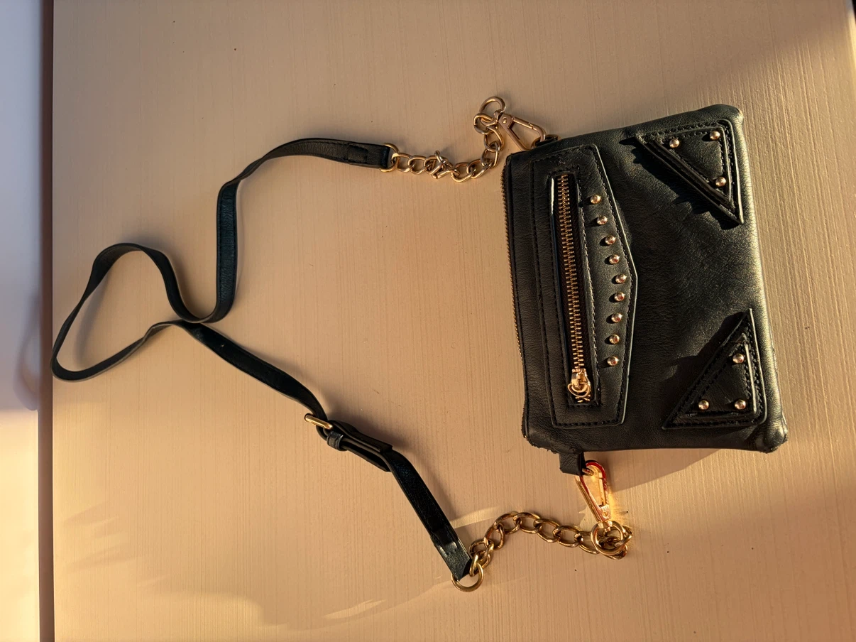 Black clutch with gold hardware and chain strap