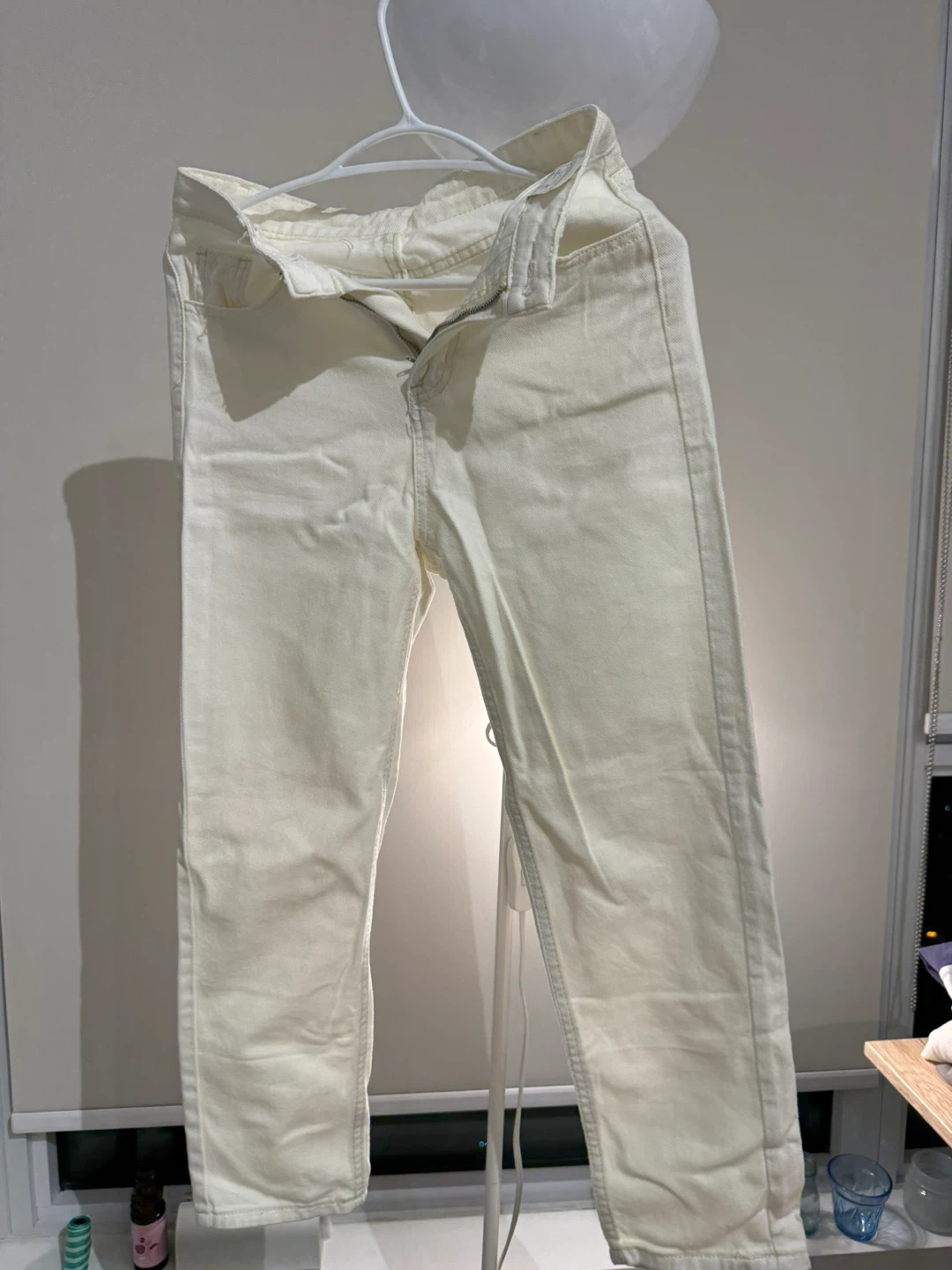 Cream-coloured high-waisted jeans