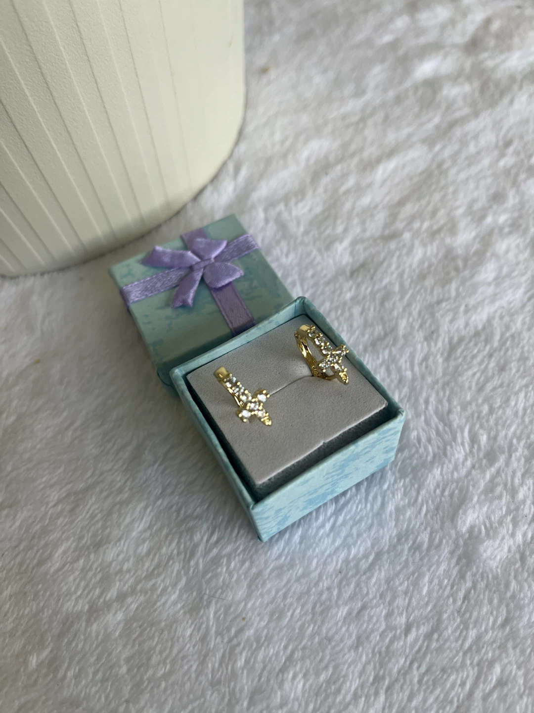 Gold-tone earrings with rhinestone cross detail