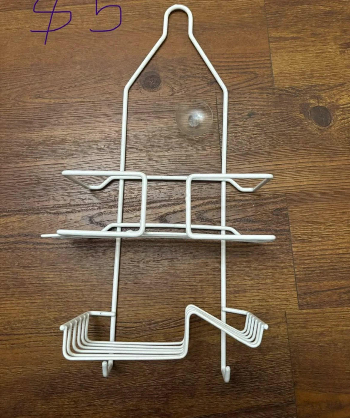 White metal shower caddy and silver over-the-door hook rack