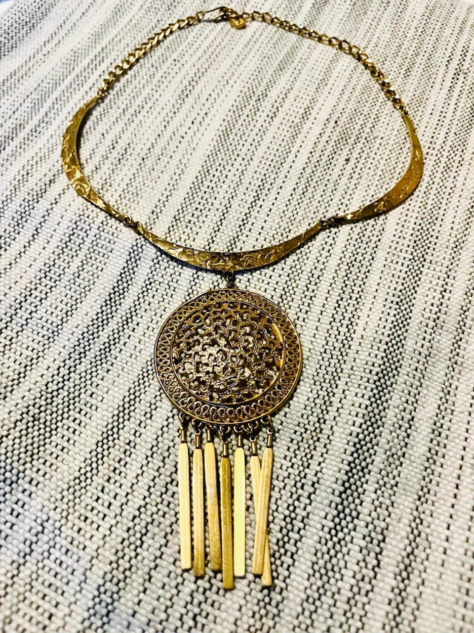 Gold-tone statement necklace with ornate pendant - photo 2
