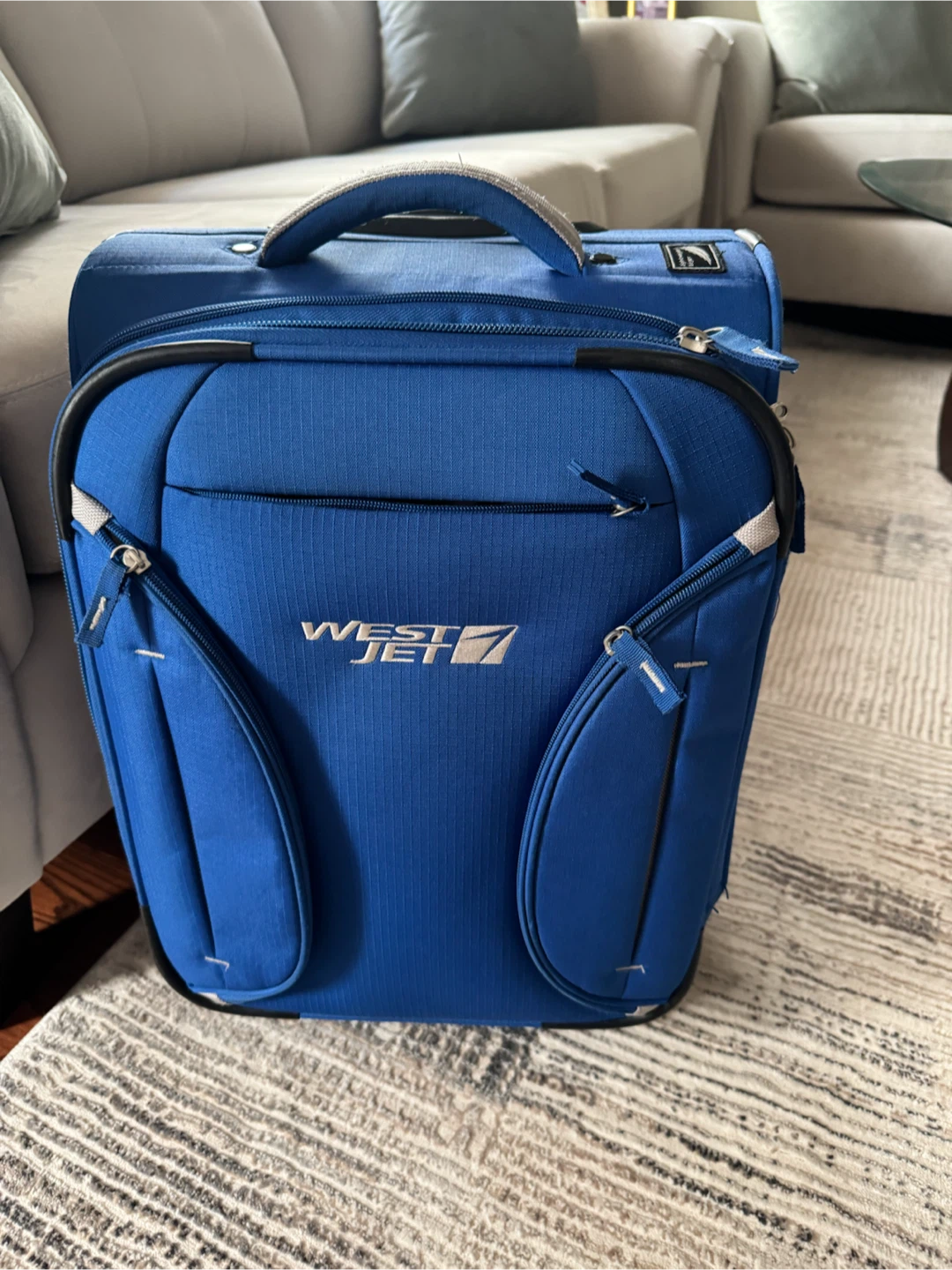 WestJet Rolling Carry-On Suitcase - Blue